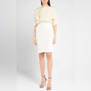 Versace ivory colored cocktail dress with Medusa detailing on shoulders.